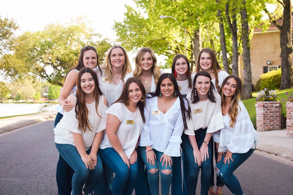 A group of sorority women standing together in recruitment attire